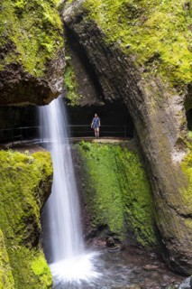 Hiker at Levada do Moinho, Waterfall in a gorge, Ponta do Sol, Madeira, Portugal, Europe