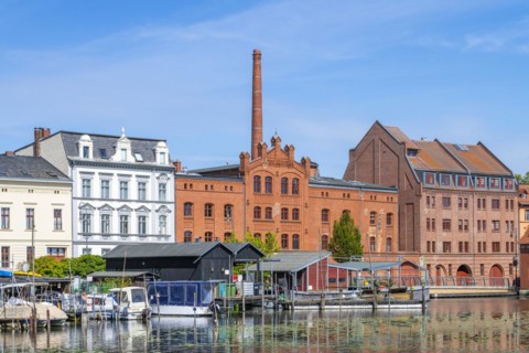 Boathouses, residential buildings and industrial architecture on Muehlendamm, Brandenburg an der Havel, Brandenburg, Germany, Europe