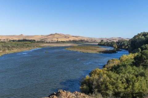 Orange River, also known as the Orange River, on the border between Namibia and South Africa, Oranjemund, Sperrgebiet National Park, also known as Tsau ÇKhaeb National Park, Namibia, Africa