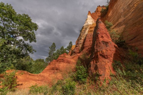 Red ocher cliff in the Luberon in Provence. Roussilon, Vaucluse, France, Europe