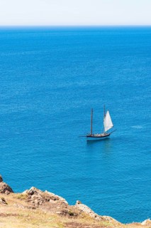 Boat in Kynance Cove Mermaid Pool and Cliffs, Cornwall, England, United Kingdom, Europe