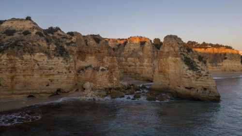 Sunset at Praia da Marinha, rocks and cliffs, steep coast in the Algarve, Portugal, Europe