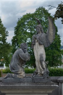 Sculptures on an old tomb, cemetery of Riezlern in Kleinwalsertal, Austria, Europe