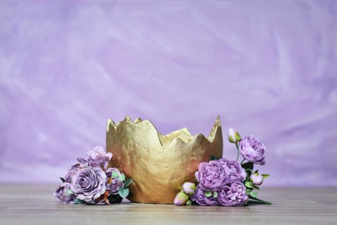 Newborn digital backdrop with golden egg with flowers on violet background