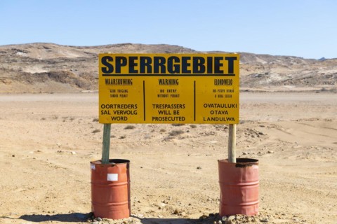 Warning sign at the diamond exclusion zone in the Sperrgebiet National Park, also Tsau ÇKhaeb National Park, Namibia, Africa