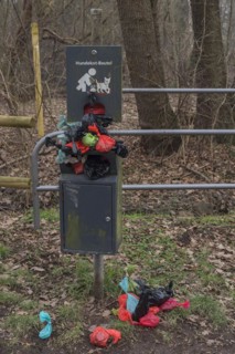 Overcrowded collection point for dog excrement bags in the meadow meadows of the Pegnitz, Bavaria, Germany, Europe