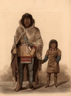 Portrait of Akaitcho, a Copper Indian, and Chief of the Yellowknives, and his son, Native American and boy, dressed in skin and fur clothing. The man holds a rifle, and both wear gloves, Historic, dig...