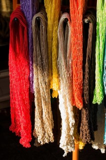 Empty mesh bags of various color at a market place
