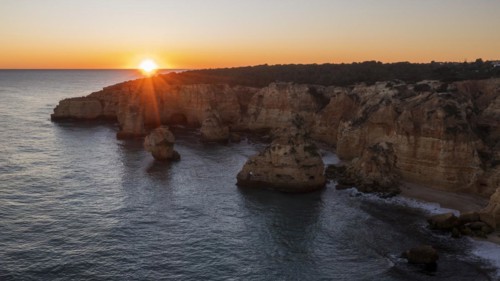 Sunset at Praia da Marinha, rocks and cliffs, steep coast in the Algarve, Portugal, Europe