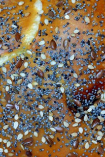 Detail of a roll with seeds, pretzel roll