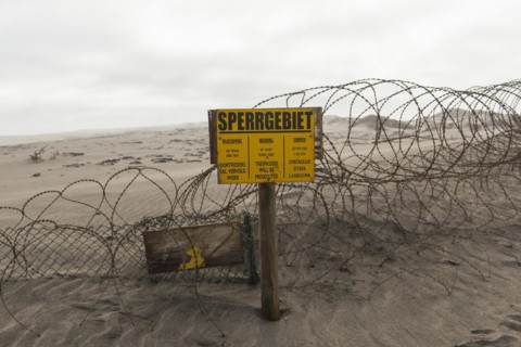 Warning sign at the diamond exclusion zone in the Sperrgebiet National Park, also Tsau ÇKhaeb National Park, Namibia, Africa