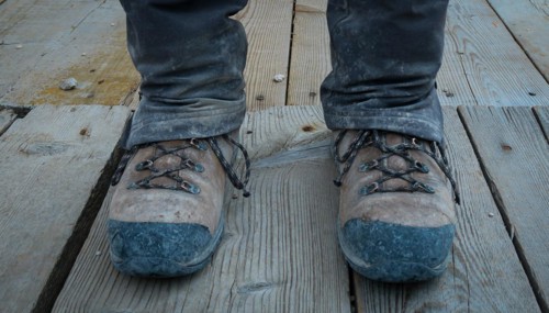 Dirty trekking shoes on the mountain trail. Dolomites, Italy, Dolomites, Italy, Europe