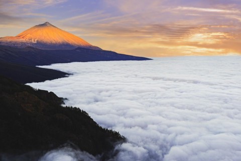 Pico del Teide at sunrise over trade wind clouds, Teide National Park, Tenerife, Canary Islands, Spain, Europe