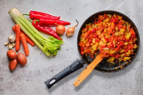 Top view of raw ingredients and ready to eat vegetable ragout