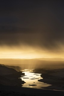 Thunderstorm over the Orange River, also known as the Orange River, on the border between Namibia and South Africa, Oranjemund, Sperrgebiet National Park, also known as Tsau ÇKhaeb National Park, Nam...