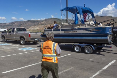 Gunnison, Colorado, Carol Soell, a boat inspector at Curecanti National Recreation Area, checks boats entering and leaving Blue Mesa Reservoir for invasive species. Colorados mandatory inspection prog...