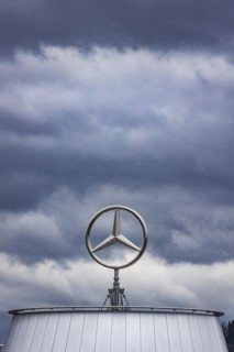 Mercedes star above the Mercedes Center in Untertuerkheim, clouds in the sky, Stuttgart, Baden-Wuerttemberg, Germany, Europe