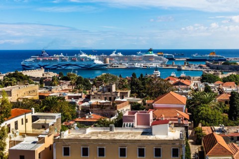 View of Mandraki harbour with cruise ships, Rhodes Town, Greece, Europe