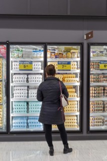 Macomb Twp., Michigan, A woman shops for eggs at a Meijer Grocery store, newly opened in suburban Detroit. The stores grocery-only concept is new for the chain. Its huge supercenters sell clothing, ho...