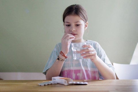 Ten-year-old girl with tablets, Bonn, Germany, Europe