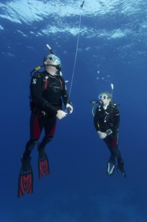 Diver, diver, exercise, setting the safety buoy, 4. When the buoy is filled with air, immediately let it rise on the rope to the surface of the water, Red Sea, Hurghada, Egypt, Africa
