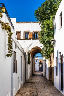 Captains house in the winding streets with white houses, Lindos, Rhodes, Greece, Europe