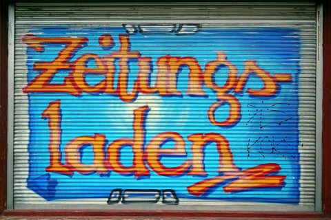 Colourfully painted blind of a shop window at a newspaper shop, Kreuzberg, Berlin, Germany, Europe