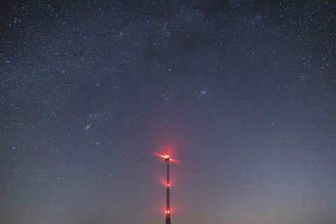 An illuminated wind turbine stands out against the starry sky in Vierkirchen, 14.02.2023., Vierkirchen, Germany, Europe