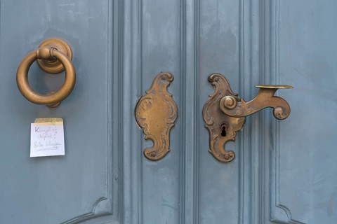Historic brass door lock and knocker, Lueneburg, Lower Saxony, Germany, Europe