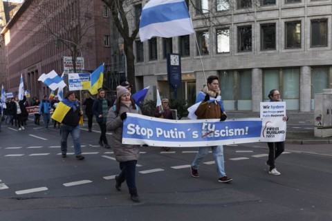 Demonstrators with banner Stop Putin, demonstration against the Ukraine war on 25.2.23, Duesseldorf, North Rhine-Westphalia, Germany, Europe