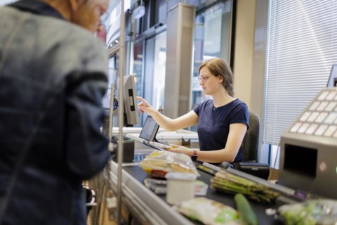 Cashier in a supermarket. Radevormwald, Germany, Europe