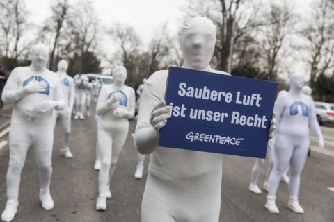 Protest of the environmental organisation Greenpeace, on the Bundesstrasse 14 40 activists demand better air quality, the Neckartor is considered the most polluted street in Germany with high levels o...