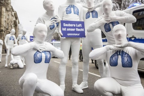 Protest of the environmental organisation Greenpeace, on the Bundesstrasse 14 40 activists demand better air quality, the Neckartor is considered the most polluted street in Germany with high levels o...