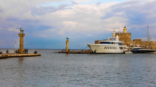 Mandraki harbour, harbour entrance with columns with stag and hind, site of the Colossus of Rhodes, Rhodes Town, Greece, Europe