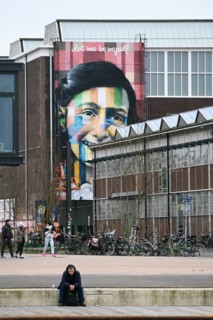 Anne Frank portrait on the facade of the Straat Museum, NDSM Plein, Amsterdam, Netherlands
