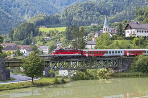 OeBB passenger train with electric locomotive 1042 on the Kronprinz Rudolfbahn on the bridge over the Enns in Reichraming, Upper Austria, Austria, Europe