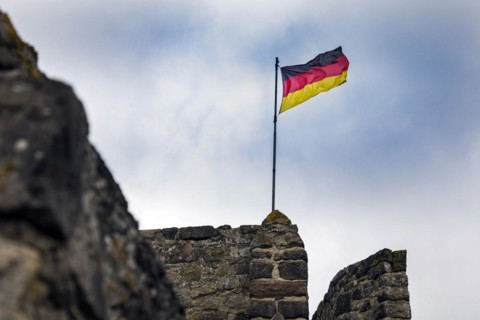 German flag of the town fortification from the 13th century, with town wall, battlements and witchs tower, Hillesheim, Rhineland-Palatinate, Germany, Europe