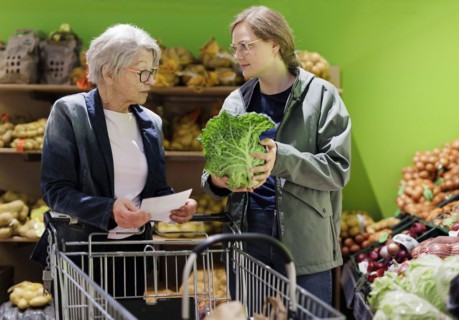 Elderly woman shopping in supermarket, Radevormwald, Germany, Europe