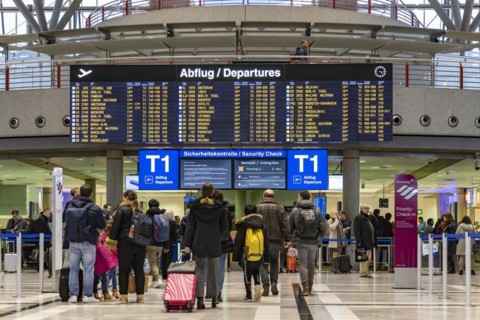 Airport terminal with departure indicator board, departure, travellers with suitcases, interior shot, Airport Echterdingen, Stuttgart, Baden-Wuerttemberg, Germany, Europe