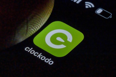 Symbolic photo on the subject of digital time recording. The Clockodo app is used to record an employees working hours on a smartphone. Berlin, Berlin, Germany, Europe