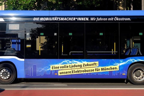 Advertisement for e-mobility on an electric bus, e-bus of MVG, Muenchner Verkehrsgesellschaft, side view, Munich, Bavaria, Germany, Europe