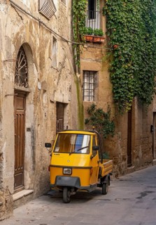 Three-wheeler in the streets of Pitigliano old town, Tuscany, Italy, Europe