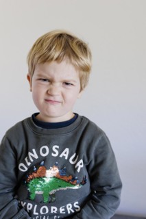 Bonn. Toddler shows his feelings, here the feeling of scepticism. Bonn, Germany, Europe
