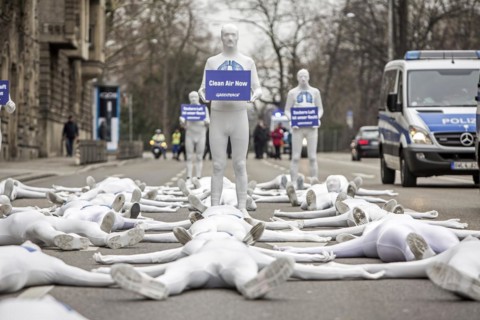 Protest of the environmental organisation Greenpeace, on the Bundesstrasse 14 40 activists demand better air quality, the Neckartor is considered the most polluted street in Germany with high levels o...