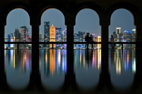 View of the illuminated skyline of Doha, Qatar, from the terrace of the Museum of Islamic Art by the archtics Ieoh Ming Pei and Jean-Michel Wilmotte, Asia