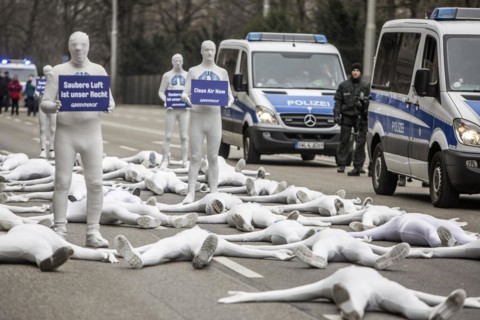 Protest of the environmental organisation Greenpeace, on the Bundesstrasse 14 40 activists demand better air quality, the Neckartor is considered the most polluted street in Germany with high levels o...