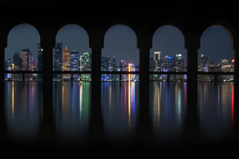 View of the illuminated skyline of Doha, Qatar, from the terrace of the Museum of Islamic Art by the archtics Ieoh Ming Pei and Jean-Michel Wilmotte, Asia
