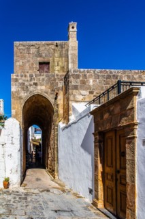 Captains house in the winding streets with white houses, Lindos, Rhodes, Greece, Europe