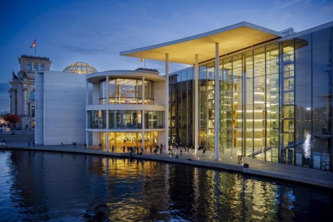 People dance in the evening next to the river Spree at Paul-Loebe-Haus in the government district. Berlin, Berlin, Germany, Europe