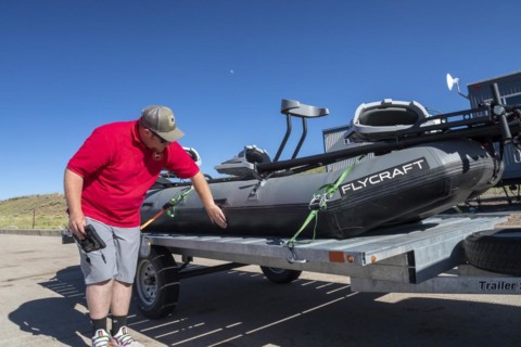 Evanston, Wyoming, An employee of the Wyoming Game & Fish Department inspects watercraft at a mandatory inspection station along the Utah border. The intent is to keep invasive aquatic species, includ...